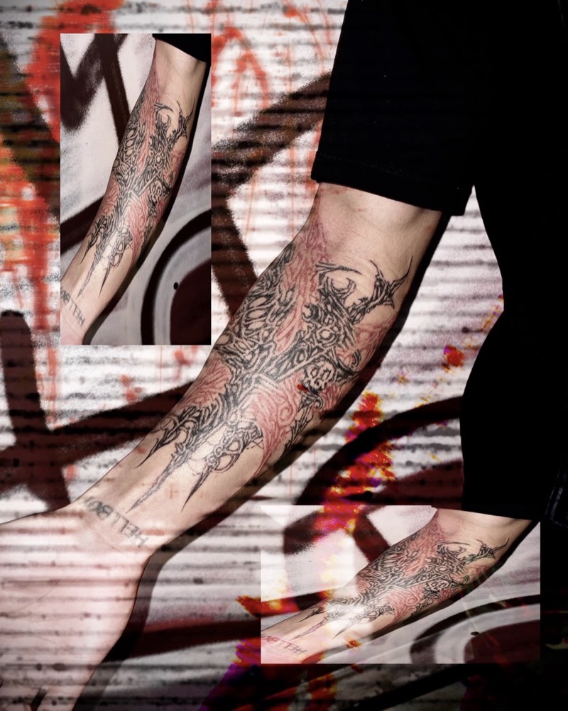 Completed tattoo on the forearm: a spiky ornamental design in black over a red line pattern, shown in three views